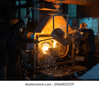 Pouring molten metal into a centrifugal machine - Powered by Shutterstock