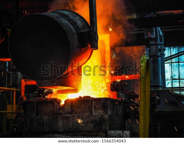 Pouring Molten Ore Ladle Pouring Into Stock Photo 1566354043 