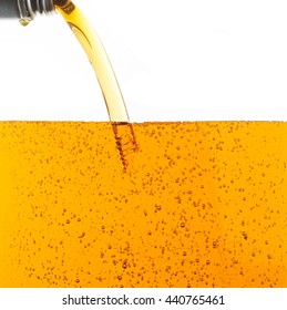 Pouring motor oil on white background