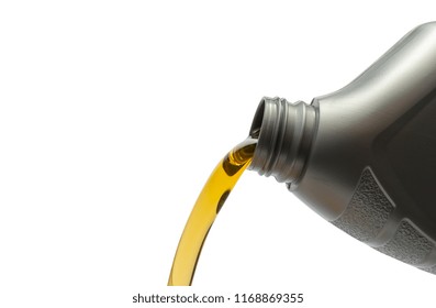 Pouring Oil From Bottle On Isolated White Background