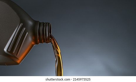 Pouring Oil from Plastic Container, Macro Shot