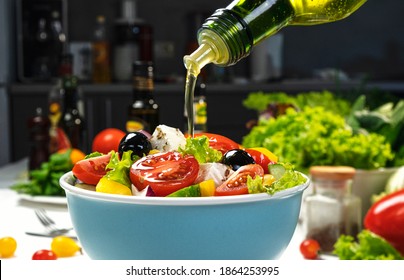 Pouring Olive Oil On Fresh Vegetable Salad, Mediterranean Cuisine, Greek Salad, White Table Served With Healthy Food Ingredients