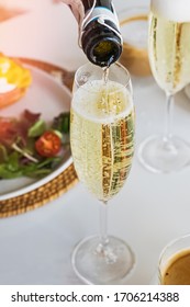 Pouring Prosecco Sparkling Wine In A Glass On Sunday Brunch. Selective Focus