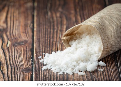 pouring salt from sac to floor