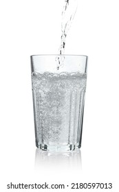 Pouring Soda Water Into Glass On White Background