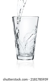 Pouring Soda Water Into Glass On White Background