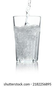 Pouring Soda Water Into Glass On White Background