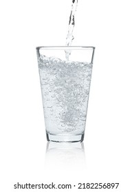 Pouring Soda Water Into Glass On White Background