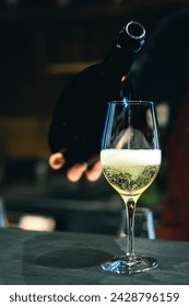 Pouring sparkling wine in a fine gourmet restaurant in italy.