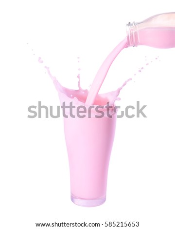 Pouring strawberry milk from bottle into glass with splashing., Isolated white background.