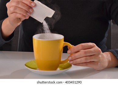 Pouring Sugar Bag On Coffee Cup.