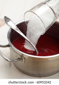 Pouring Sugar Into The Red Currant Syrup