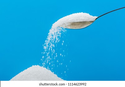 Pouring Sugar On A Pile Of Sugar