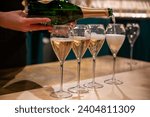 Pouring and tasting of dry sparkling wine champagne on winter weekend festival in December on Avenue de Champagne, Epernay, Champagne region, France