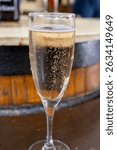 Pouring and tasting of dry white sparkling wine brut, grand reserve, champagne in grand cru Ay-Champagne wine making village in Vallee de la Marne, , Champagne region, France