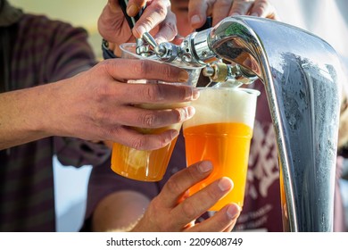 Pouring A Tasty Cold Draft Craft Beer On A Beer Festival