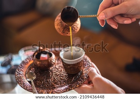 Pouring the traditional Bosnian (Turkish) coffee, served traditionally in Bascarsija, city centre of Sarajevo, capital town of Bosnia and Herzegovina.