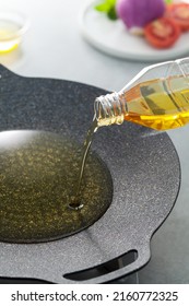 Pouring Vegetable Oil To A Frying Pan.