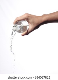 Pouring Water From Bottle Glass Isolated White Background.