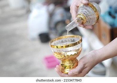 Pouring water is a dedication of merit to relatives and acquaintances who have passed away. or body deity souls without relatives is a belief in Buddhism
