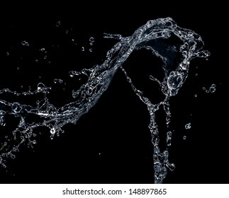 Pouring Water On A Jet Black Background