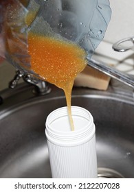 Pouring Water Softening Ion Exchange Resin In The Filter Cartridge After Recovery