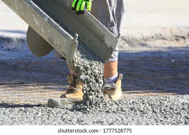 Pouring Wet Concrete While Paving A Driveway