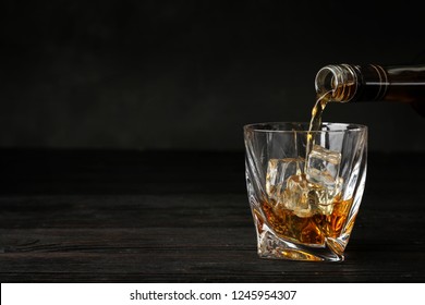 Pouring Whiskey Bottle Into Glass Ice Stock Photo 1245954307 | Shutterstock