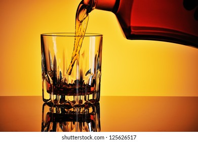 Pouring Whisky Into A Glass