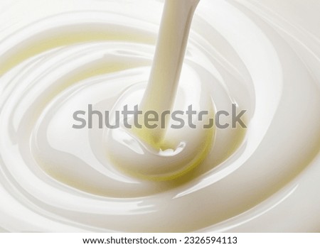 Pouring White Liquid into A Glass