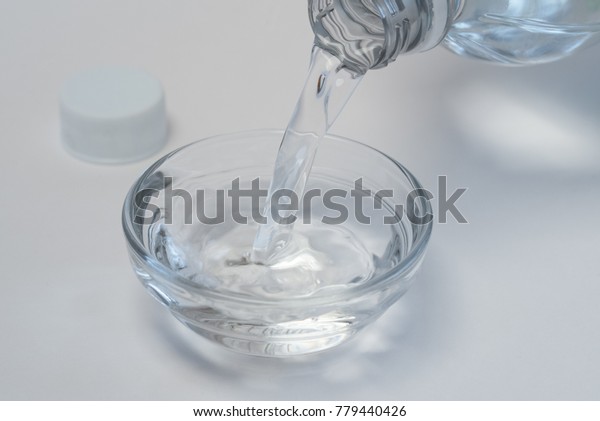 Pouring White\
Vinegar into an Ingredient\
Bowl