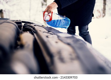 Pouring Windshield Fluid In Car