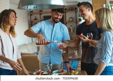 Pouring wine, enjoying with friends - Powered by Shutterstock