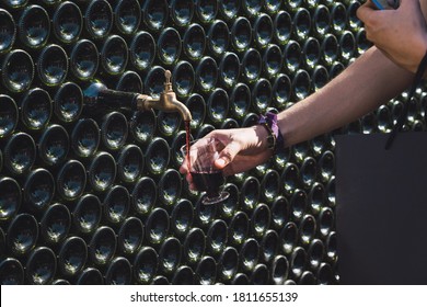 Pouring Wine In A Glass From A Wine Fountain