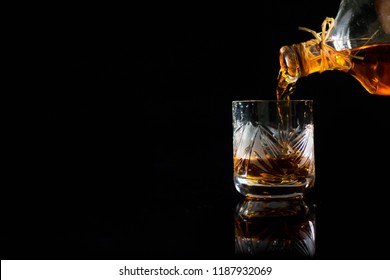 Pouring Wiskey Into The Glass