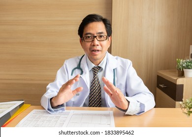 POV Asian Man Doctor Talking With Patient Via Video Call Conference, Telehealth Or Telemedicine Concept