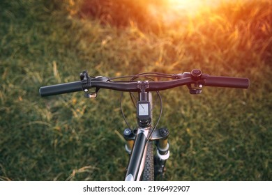 POV Bike Handlebar With A Nature Backdrop. Leisure Time In Summer Evening Concept.