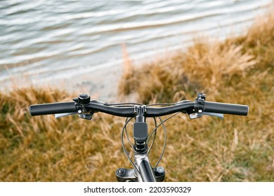 POV Bike Handlebar With A Nature Backdrop. Leisure Time In Summer Evening Concept.