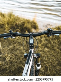 POV Bike Handlebar With A Nature Backdrop. Leisure Time In Summer Evening Concept.