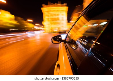 POV Of Car Driving At Night City With Motion Blur Effect. Transportation And Traffic Concept