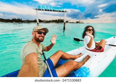 POV Couple take selfie enjoy Kayaking activity on turquoise tropical waters. Vacation in Maldives. Fulidhoo island coastline and sports activities - Powered by Shutterstock