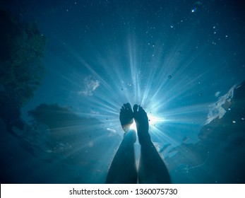 POV Of Feet In Dark Water