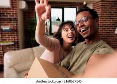 POV Of Happy Homeowners Holding House Keys Of Rented Flat, Moving In New Household Property Together To Start Family. Enjoying Relocation And Life Event For New Beginnings, Real Estate.