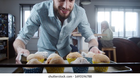 POV Inside Oven, Young Happy Caucasian Father Takes Fresh Baked Cupcakes Out Of Stove. Cooking With Family Slow Motion.