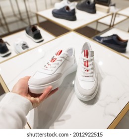 POV Male Hand Choosing A New White Sneakers In The Shoes Store