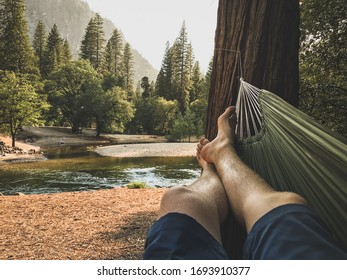 POV of Mans legs in a Hammock (Yosemite Vally) - Powered by Shutterstock