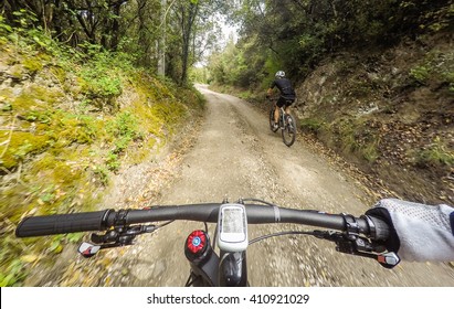 POV, Original Point Of View. Pair Of Man On Mountain Bike  In A Mountainous Road.