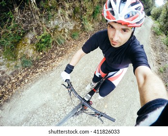 POV, Original Point Of View. Young Man On Bicycle Take A Selfie. Training On Mountain Bike On A Mountainous Road.