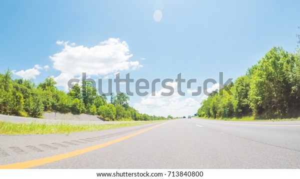 POV point of view - Driving East\
on Interstate Highway 40 on cross-country road\
trip.