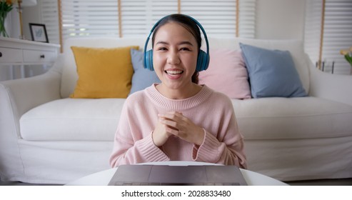 POV screen front view of asia people teen girl sit relax smile cheerful at sofa enjoy talk share in job experience in MBA school tutor class. Greeting waving hand lady look at camera meeting on web. - Shutterstock ID 2028833480